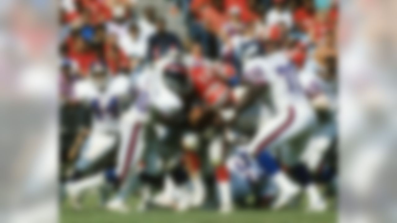 ATLANTA, GA - OCTOBER 9: Linebacker Lawrence Taylor #56 of the New York Giants drills running back Lynn Cain #21 of the Atlanta Falcons in Atlanta Fulton-County Stadium on October 14, 1984 in Atlanta, Georgia. The Giants defeated the Falcons 19-7. (Photo by Gin Ellis/NFL Photos)