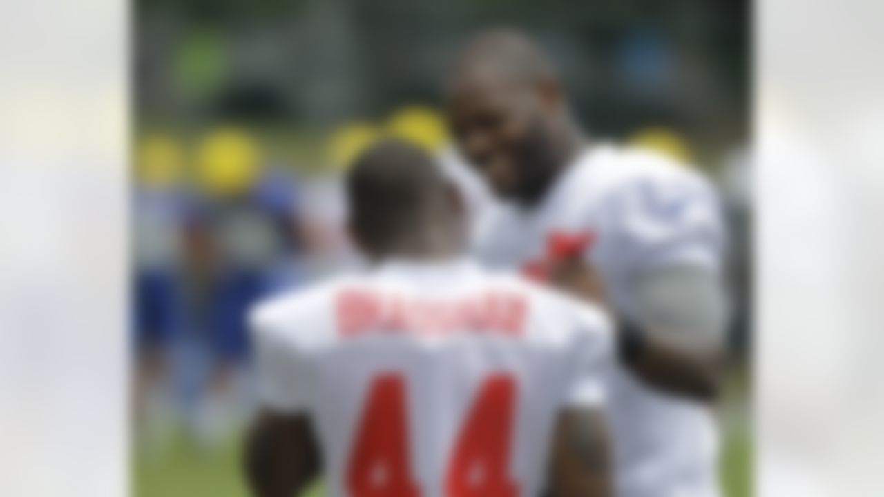 New York Giants tight end Martellus Bennett, right, chats with running back Ahmad Bradshaw (44) during a practice at the New York Giants NFL football training camp in Albany, N.Y., Friday, July 27, 2012. (AP Photo/Kathy Willens)