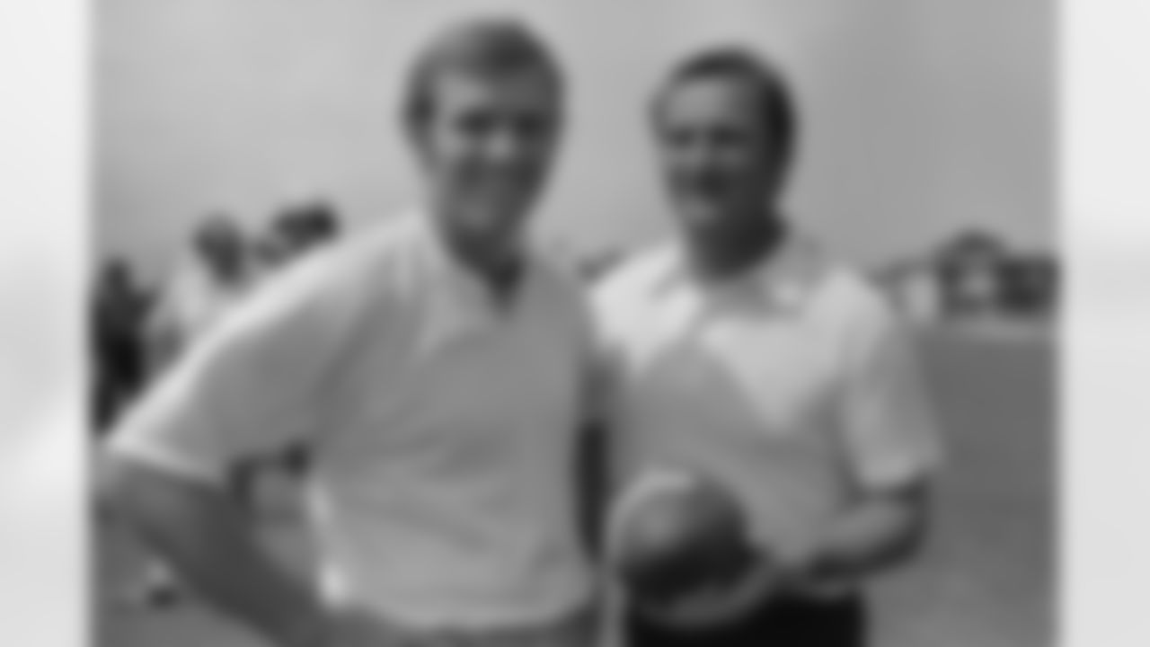 Miami Dolphins coach Don Shula, right, and quarterback Bob Griese, pose for the photographer before start of another practice session at Miami, Florida on Monday, August 7, 1972. (Associated Press)