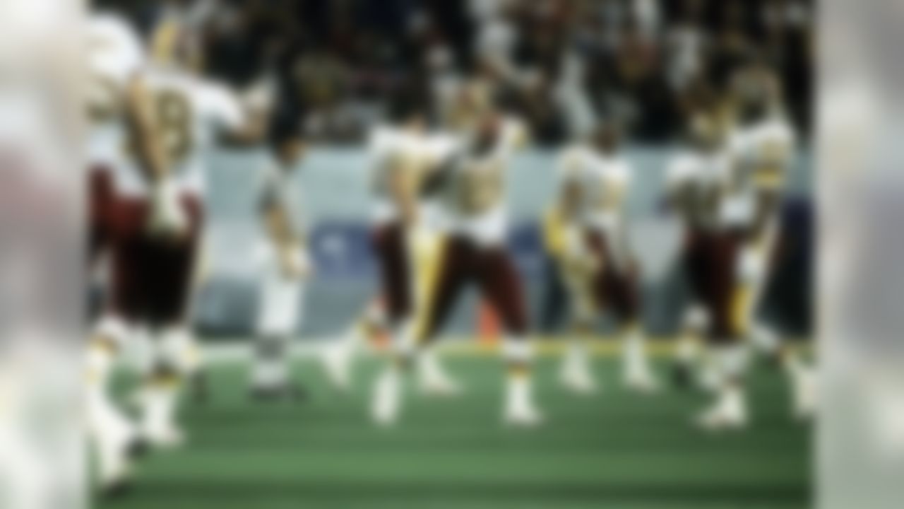 Washington Redskins cornerback Alvoid Mays (20) congratulates corner Darrell Green (28) following Green's interception during Super Bowl XXVI, a 37-24 victory over the Buffalo Bills on January 26, 1992, at the Hubert H. Humphrey Metrodome in Minneapolis, Minnesota. (AP Photo/Al Messerschmidt)