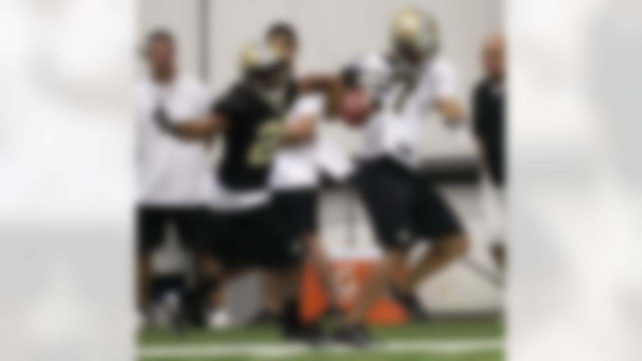 New Orleans Saints Kamaal McIlwain (25) breaks up a pass intended for wide receiver Chris Givens (17) during NFL football training camp in Metairie, La., Friday, July 27, 2012. (AP Photo/Gerald Herbert)