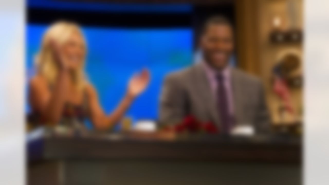Michael Strahan joins Kelly Ripa as the new co-host of "Live! with Kelly and Michael" on Tuesday, Sept. 4, 2012 in New York. (Photo by Charles Sykes/Invision/AP Images)