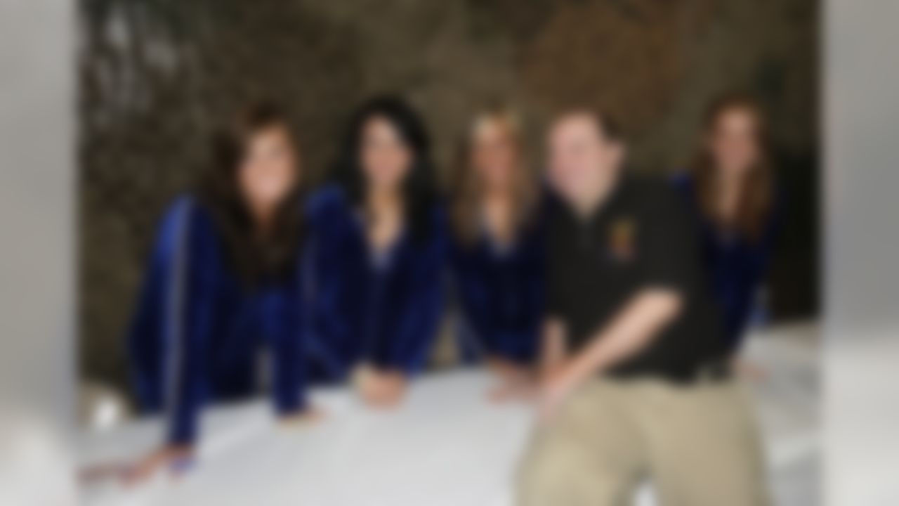 Feb 2, 2012; Edinburgh, IN, USA; A soldier who was wounded in combat poses for a photo with the Indianapolis Colts cheerleaders during the NFL players visit to Camp Atterbury. Mandatory Credit: Brian Spurlock-US PRESSWIRE