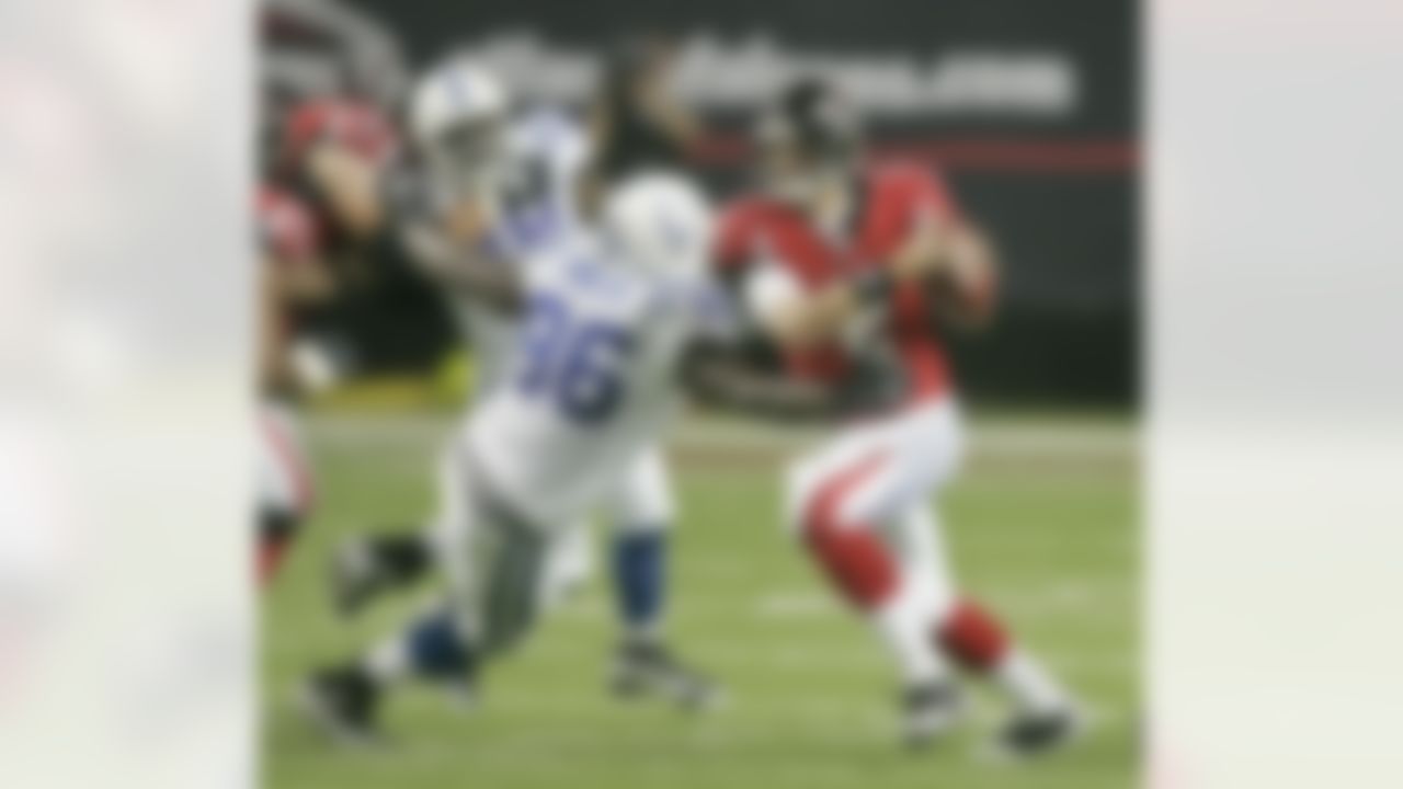 Atlanta Falcons rookie quarterback Matt Ryan, right, breaks away from Indianapolis Colts' Keyunta Dawson during the second quarter of a preseason football game Saturday, Aug. 16, 2008, in Atlanta. (AP Photo/John Bazemore)