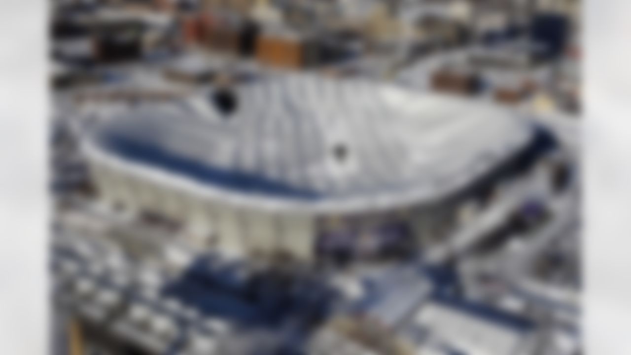 Holes in the collapsed Metrodome roof can be seen in Minneapolis Sunday, Dec. 12, 2010. The inflatable roof of the Metrodome collapsed Sunday after a snowstorm that dumped 17 inches on Minneapolis. No one was hurt, but the roof failure sent the NFL scrambling to find a new venue for the Vikings' game against the New York Giants. (AP Photo/Ann Heisenfelt)
