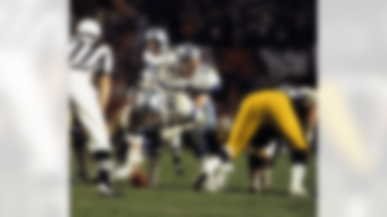 Dallas Cowboys center John Fitzgerald (62) waits to snap the ball to quarterback Roger Staubach (12) during Super Bowl XIII, a 35 - 31 loss to the Pittsburgh Steelers on January 21, 1979, at the Orange Bowl in Miami, Florida. (AP Photo/Al Messerschmidt)