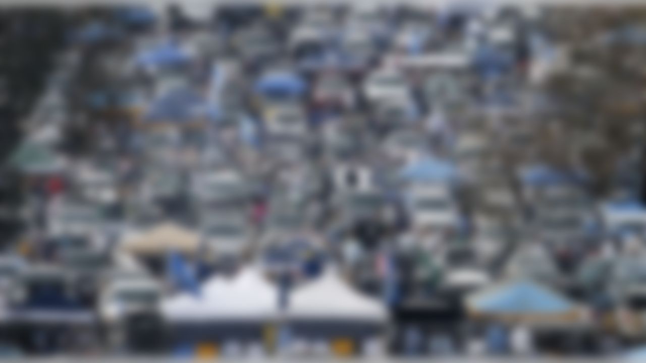 Fans gather in the parking lot as they tailgate before an NFL divisional playoff game between the New York Jets and the San Diego Chargers, Sunday, Jan. 17,2010, in San Diego. (AP Photo/Denis Poroy)