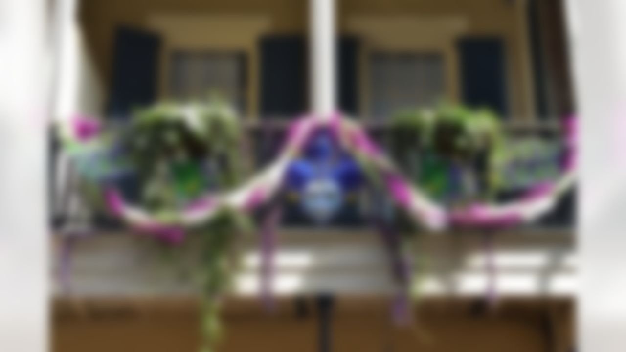 A Mardi Gras mask and decorations are displayed on a balcony on Monday, January 28, 2013 in New Orleans, LA. (Celeste Pascual/NFL)