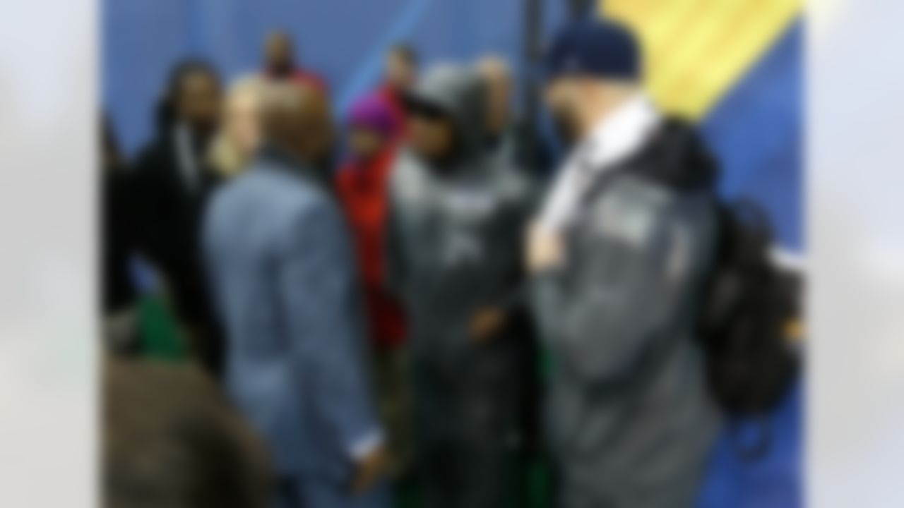 Seattle Seahawks running back Marshawn Lynch, center, speaks with NFL Network's Deion Sanders, left, during the Super Bowl XLVIII Media Day at the Prudential Center on Tuesday, January 28, 2014 in Newark, NJ. (Perry Knotts/NFL)
