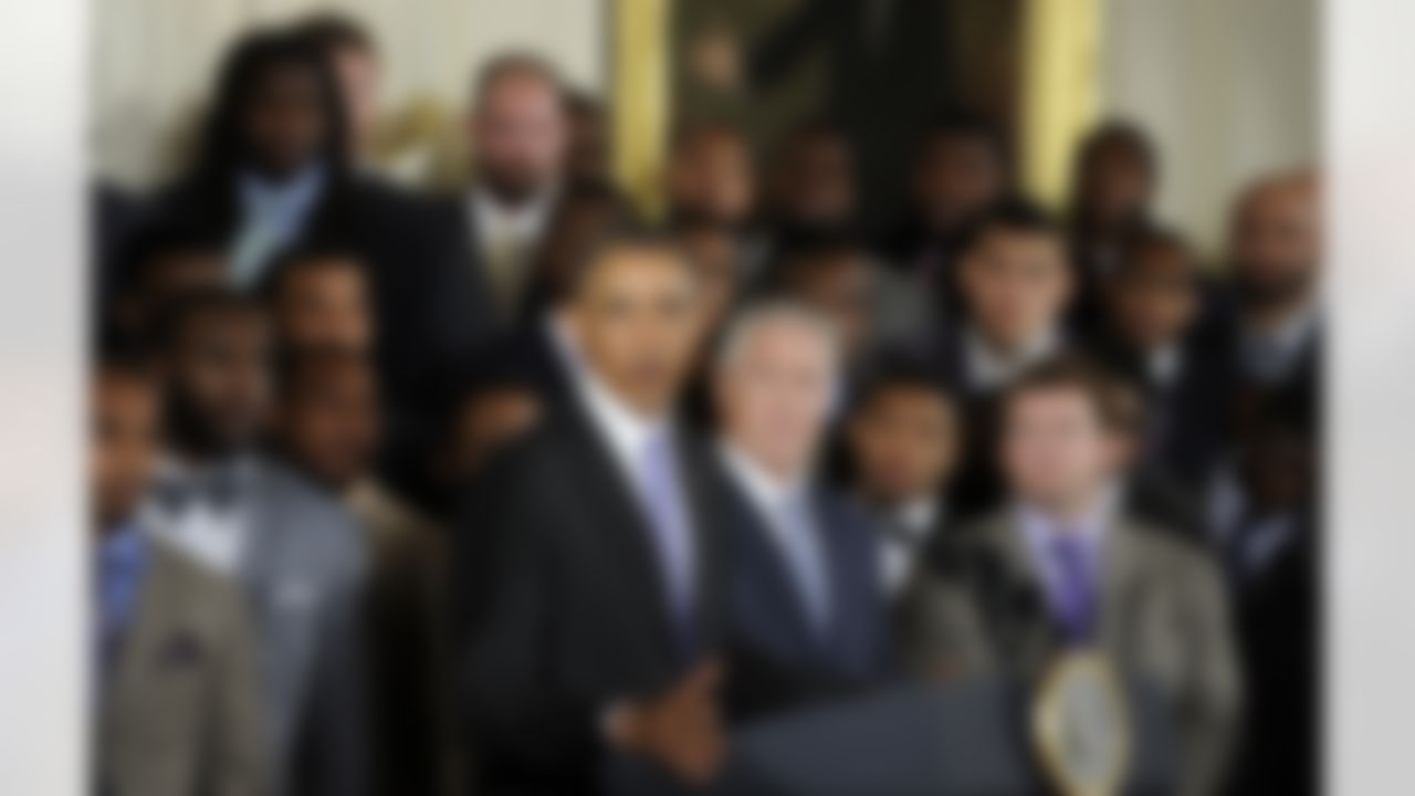 Seattle Seahawks Executive Vice President of Football Operations and Head Coach Pete Carroll, center, and Executive Vice President/General Manager John Schneider, right. and otjers, listen as President Barack Obama speaks in the East Room of the White House in Washington, Wednesday, May 21, 2014, during a ceremony where the president honored the NFL Super Bowl champion Seattle Seahawks football team. The Seahawks defeated the Denver Broncos in Super Bowl XLVIII. (Susan Walsh/Associated Press)