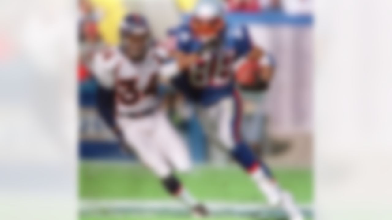 New England Patriots receiver Terry Glenn (88) runs past Denver Broncos safety Tyrone Braxton (34) during the second quarter of New England's 24-23 win at Foxboro Stadium in Foxboro, Mass. Sunday, Oct. 24, 1999. (Jim Rogash/Associated Press)