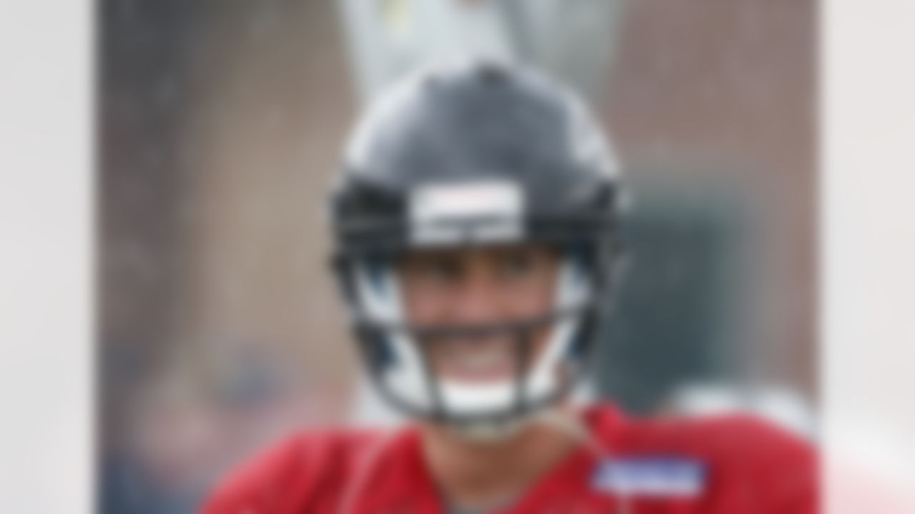 Atlanta Falcons quarterback Matt Ryan stands in the rain during NFL football training camp in Flowery Branch, Ga., Tuesday, July 31, 2012. (AP Photo/John Bazemore)