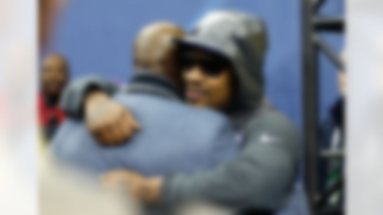 Seattle Seahawks running back Marshawn Lynch, right, hugs NFL Network's Deion Sanders during the Super Bowl XLVIII Media Day at the Prudential Center on Tuesday, January 28, 2014 in Newark, NJ. (Perry Knotts/NFL)