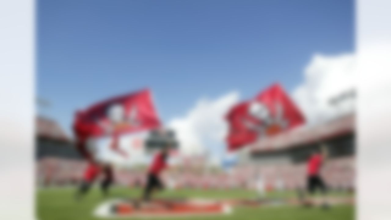 TAMPA, FL - NOVEMBER 25: Cheerleaders run on the field at the Tampa Bay Buccaneers against the Washington Redskins game on November 25, 2007 at Raymond James Stadium in Tampa, Florida. (Photo by Marc Serota/Getty Images)