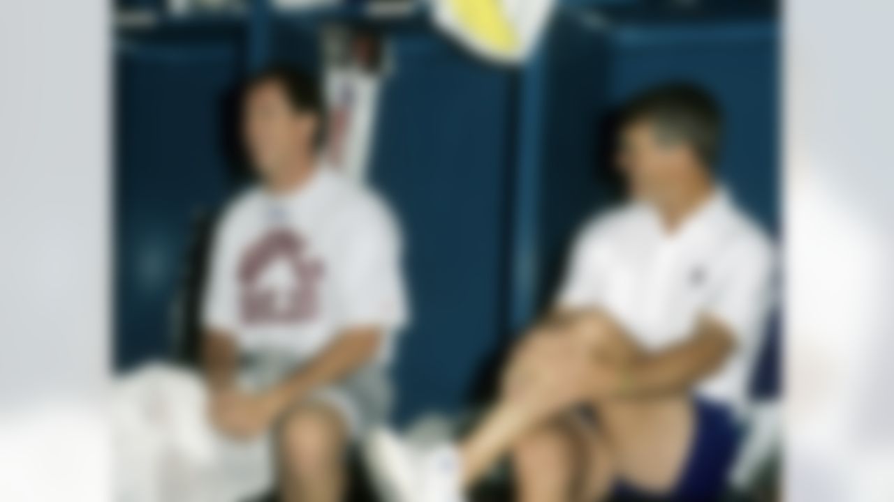 AFC Hall of Fame quarterback Jim Kelly of the Buffalo Bills with head coach Dan Reeves of the Denver Broncos in the locker room before the AFC's 21-15 loss to the NFC in the 1992 NFL Pro Bowl played on February 2, 1992 at Aloha Stadium in Honolulu, Hawaii (National Football League)