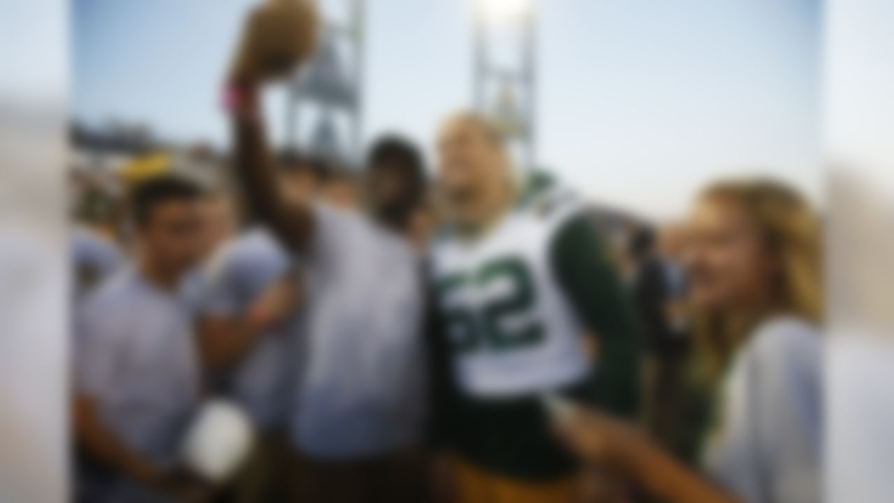 Fans take photos with Green Bay Packers linebacker Clay Matthews on the field during the NFL Hall of Fame preseason game against the Indianapolis Colts in Canton, Ohio on Sunday, Aug. 7, 2016. (Ben Liebenberg/NFL)