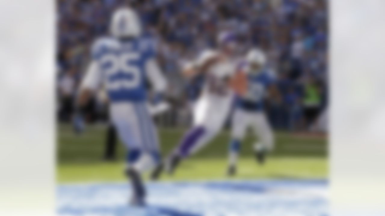 Minnesota Vikings' Kyle Rudolph (82) makes a 6-yard touchdown reception against Indianapolis Colts' Jerraud Powers (25) and Jerrell Freeman during the second half of an NFL football game in Indianapolis, Sunday, Sept. 16, 2012. (AP Photo/AJ Mast)