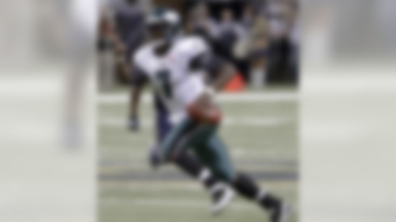 Philadelphia Eagles quarterback Michael Vick scrambles for a 19-yard gain during the second quarter of an NFL football game against the St. Louis Rams on Sunday, Sept. 11, 2011, in St. Louis. (AP Photo/Seth Perlman)