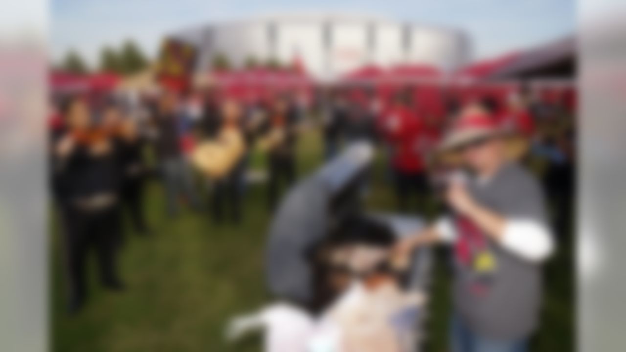 Arizona Cardinals fans tailgate on the Great Lawn before a game against the Seattle Seahawks, Sunday, Sec. 21, 2014, in Glendale, Ariz. (AP Photo/Gene Lower)