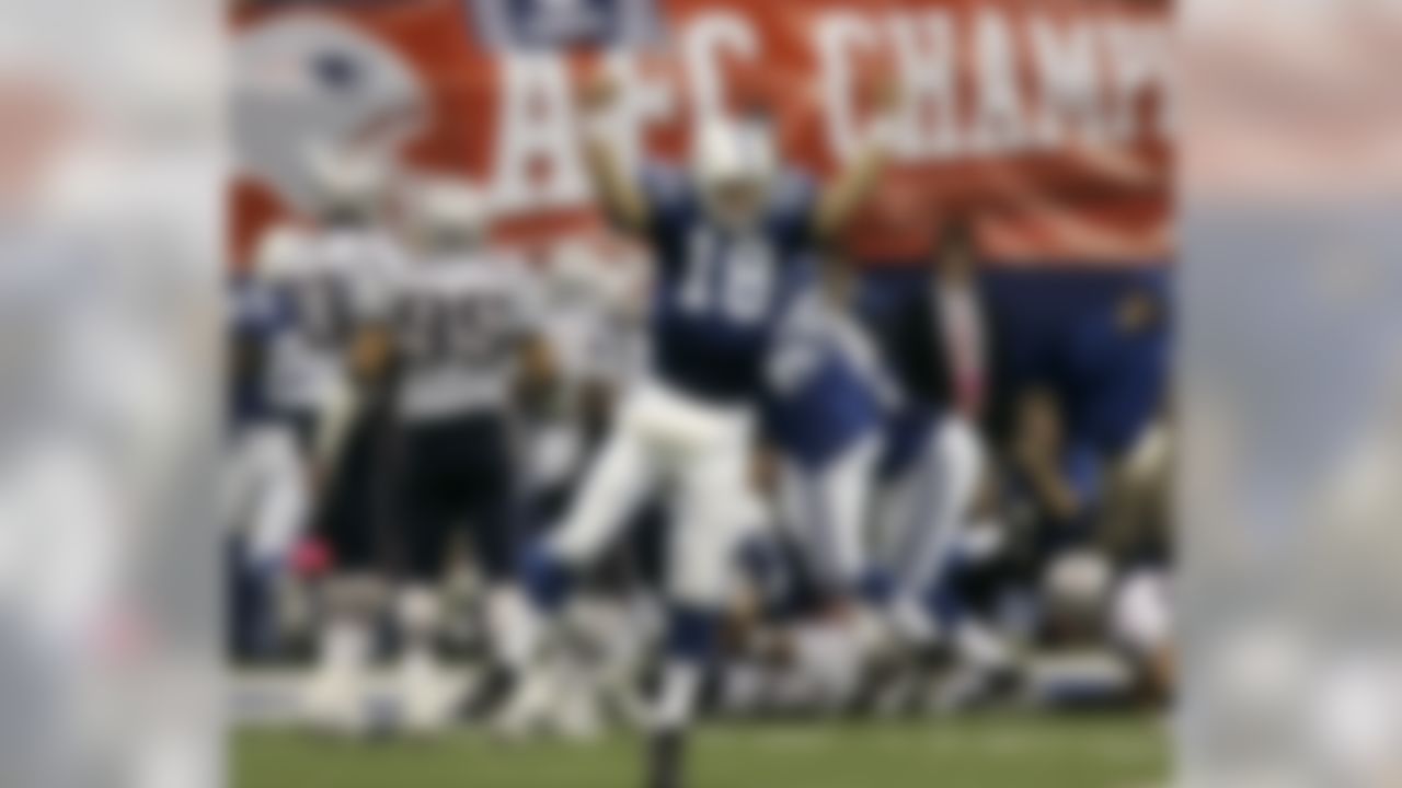 Indianapolis Colts quarterback Peyton Manning (18) celebrates running back Joseph Addai's three-yard touchdown run in the fourth quarter of the AFC Championship football game against the New England Patriots Sunday, Jan. 21, 2007, in Indianapolis. (AP Photo/Amy Sancetta)