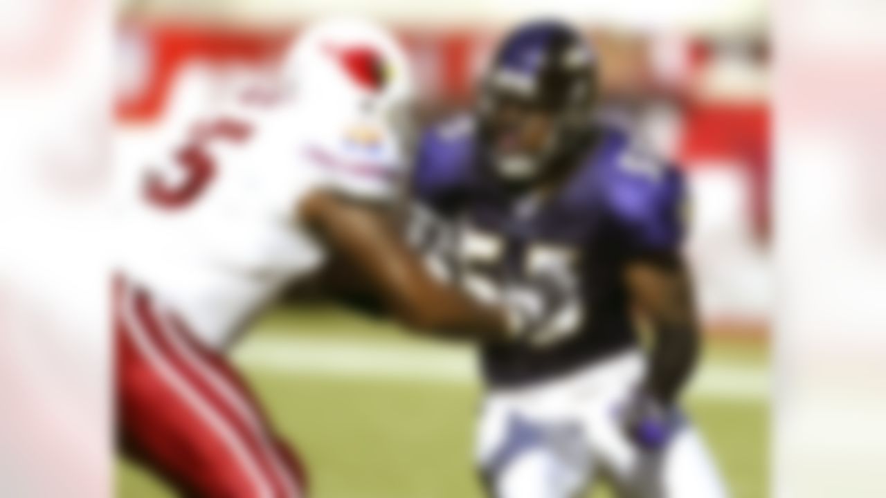 Baltimore Ravens linebacker Terrell Suggs (55) pass rushes during an NFL game against the Arizona Cardinals on October 12, 2003. The Ravens defeated the Cardinals 26-18 in Tempe, Arizona. (AP Photo/Kevin Terrell)