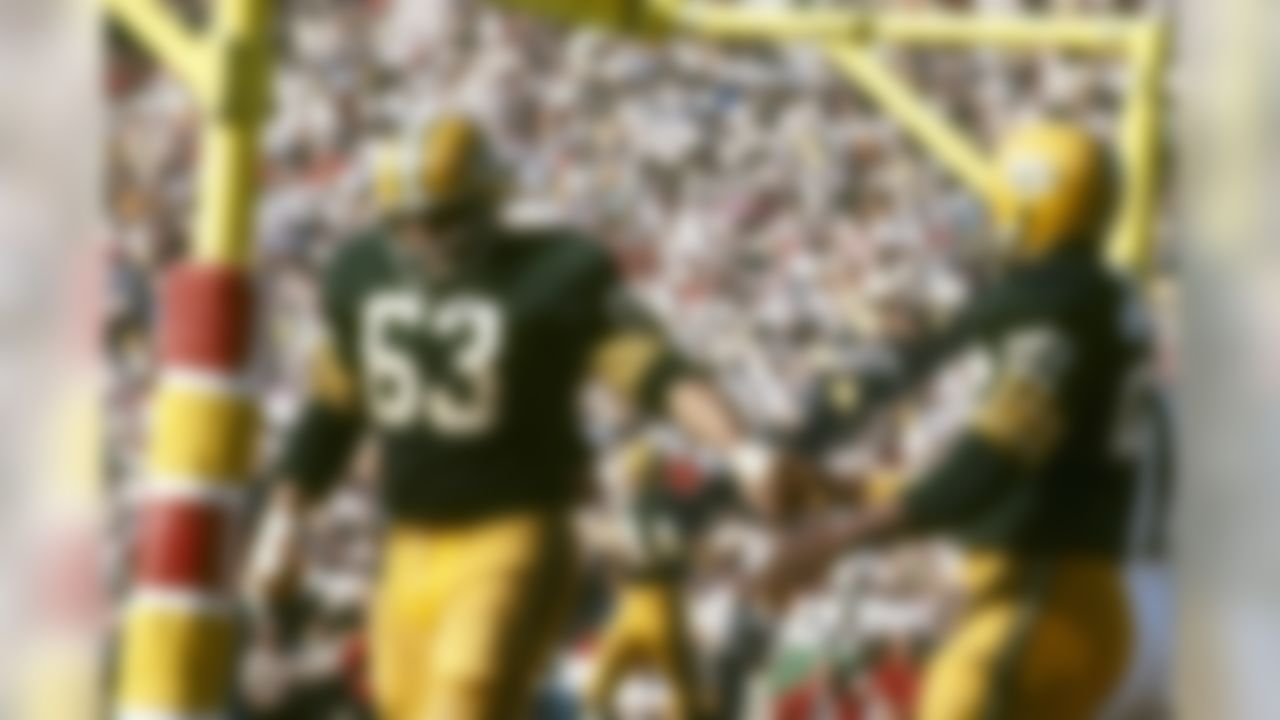 Green Bay Packers guard Fuzzy Thurston (63) congratulates running back Elijah Pitts (22) after scoring a touchdown against the Kansas City Chiefs during Super Bowl I on January 15, 1967. (National Football League)