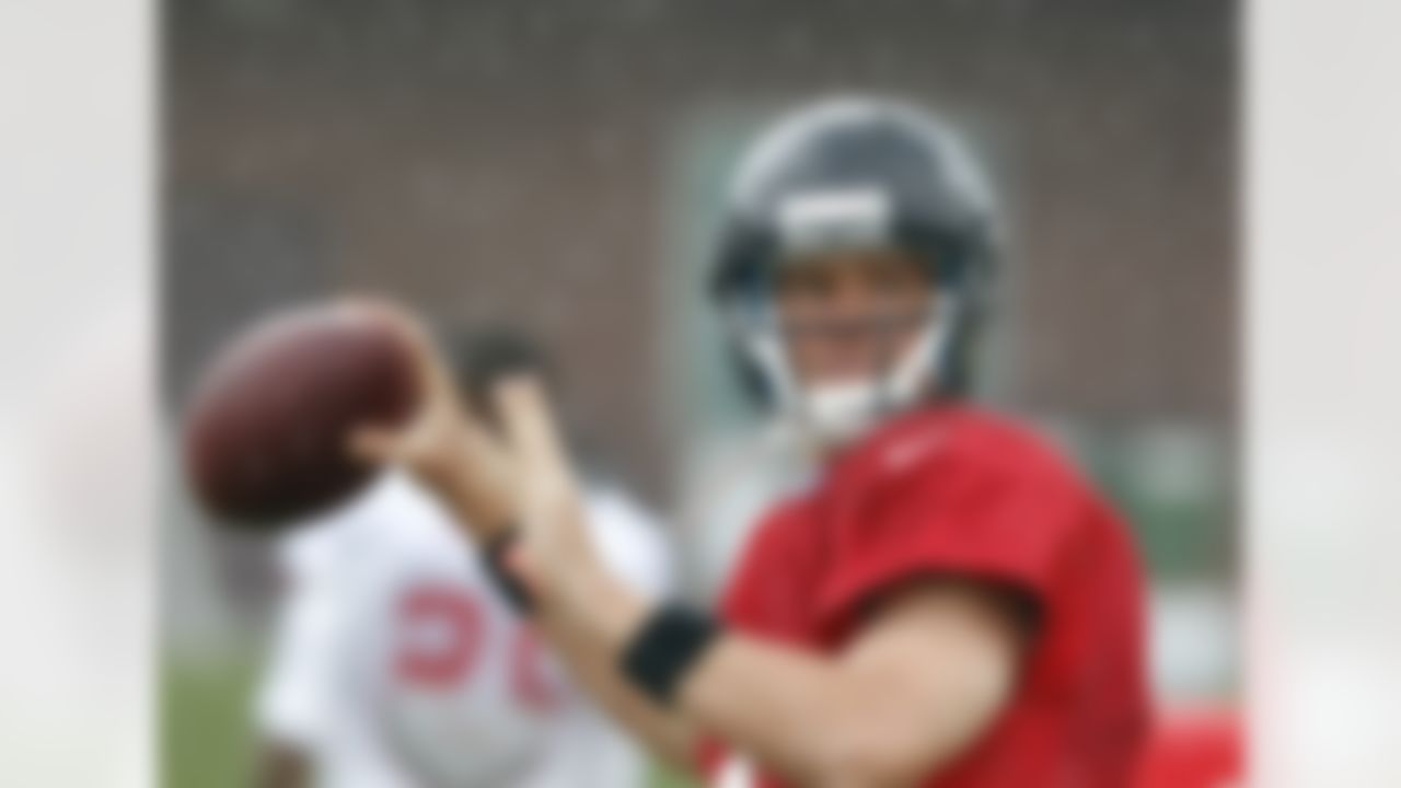 Atlanta Falcons quarterback Matt Ryan throws as rain falls during NFL football training camp in Flowery Branch, Ga., Tuesday, July 31, 2012. (AP Photo/John Bazemore)