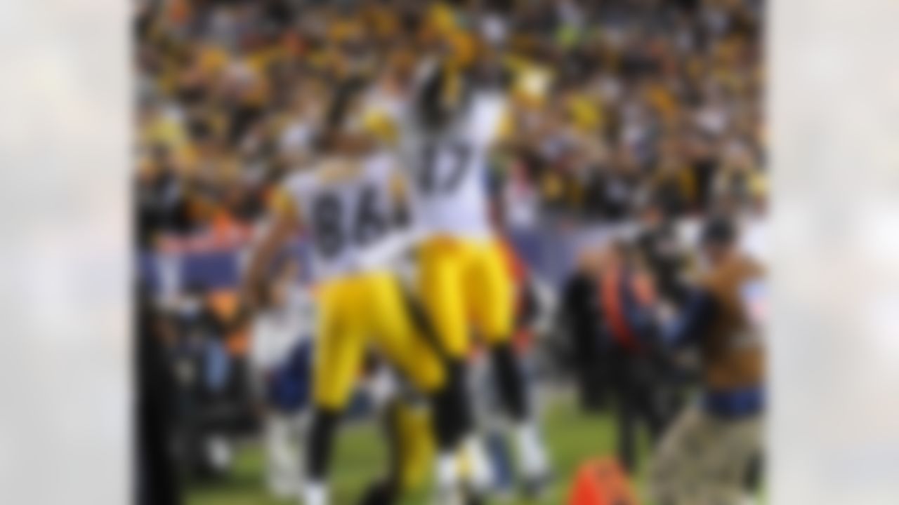 Pittsburgh Steelers wide receivers Hines Ward (86) and Mike Wallace (17) leap high to celebrate after a touchdown during the NFL football game against the Denver Broncos, Monday November 11, 2009 in Denver. The Steelers won 28 to 10. (AP Photo/Mike Fabus)