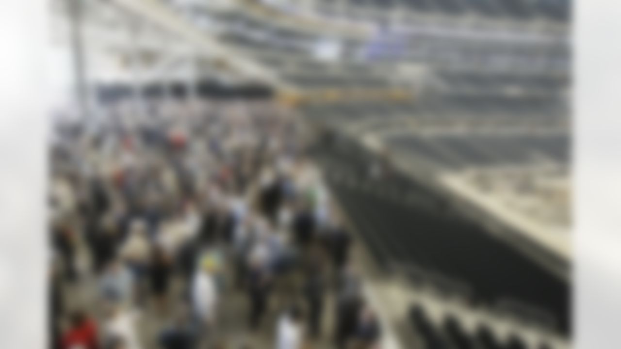Guests mingle in the West Plaza of the new Cowboys Stadium after a ribbon-cutting ceremony, Wednesday, May 27, 2009, in Arlington, Texas. (AP Photo/Matt Slocum)