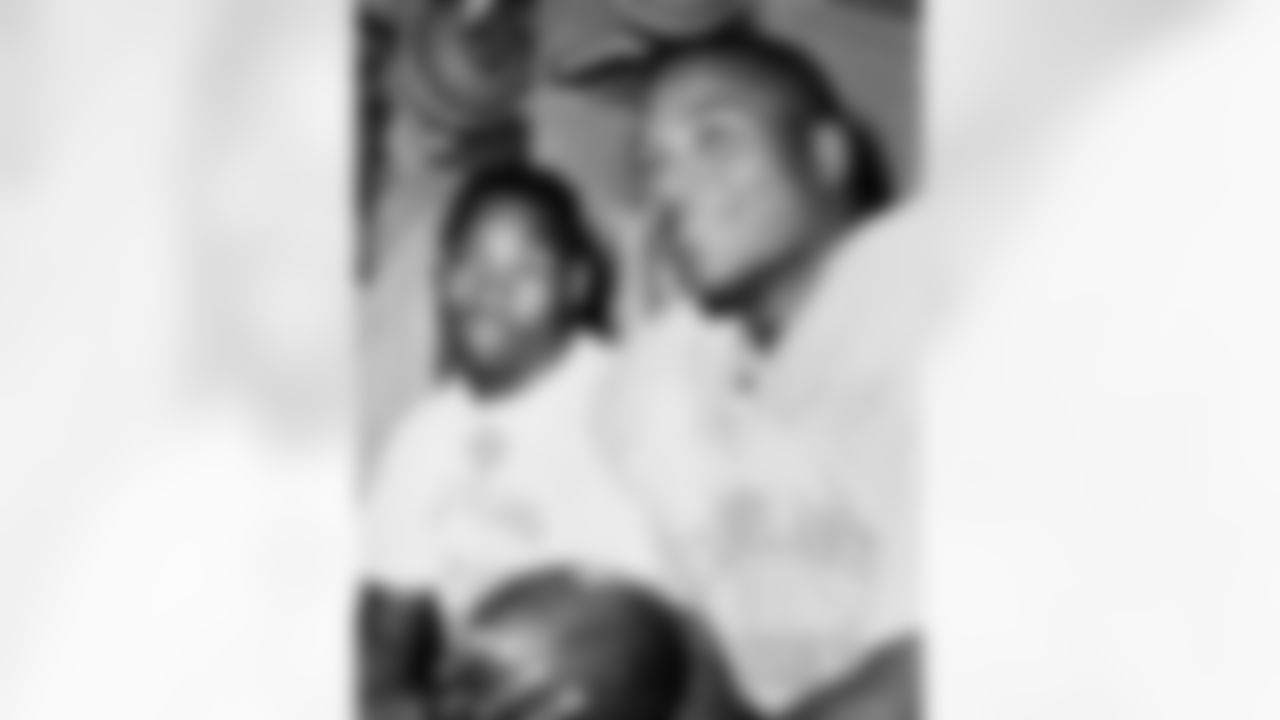 Fullback Jim Brown (left) and Halfback Bobby Mitchell (right) currently are leader and runner-up, respectively in yards gained rushing in the National Football League shown Oct. 30, 1958 in Cleveland. Brown is well on his way to an all-time pro football rushing record of 1,146 yards net 10 seasons ago by Philadelphia's Steve Van Buren. Mitchell has 414 yards in five games to Brown's 815. (Associated Press)