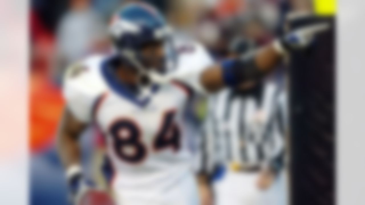 In this Nov. 16, 2003, file photo, Denver Broncos tight end Shannon Sharpe (84) points to the fans as he celebrates his third touchdown catch against the San Diego Chargers in Denver. Sharpe was elected to the Pro Football Hall of Fame on Saturday, Feb. 5, 2011. (AP Photo/Jack Dempsey, File)