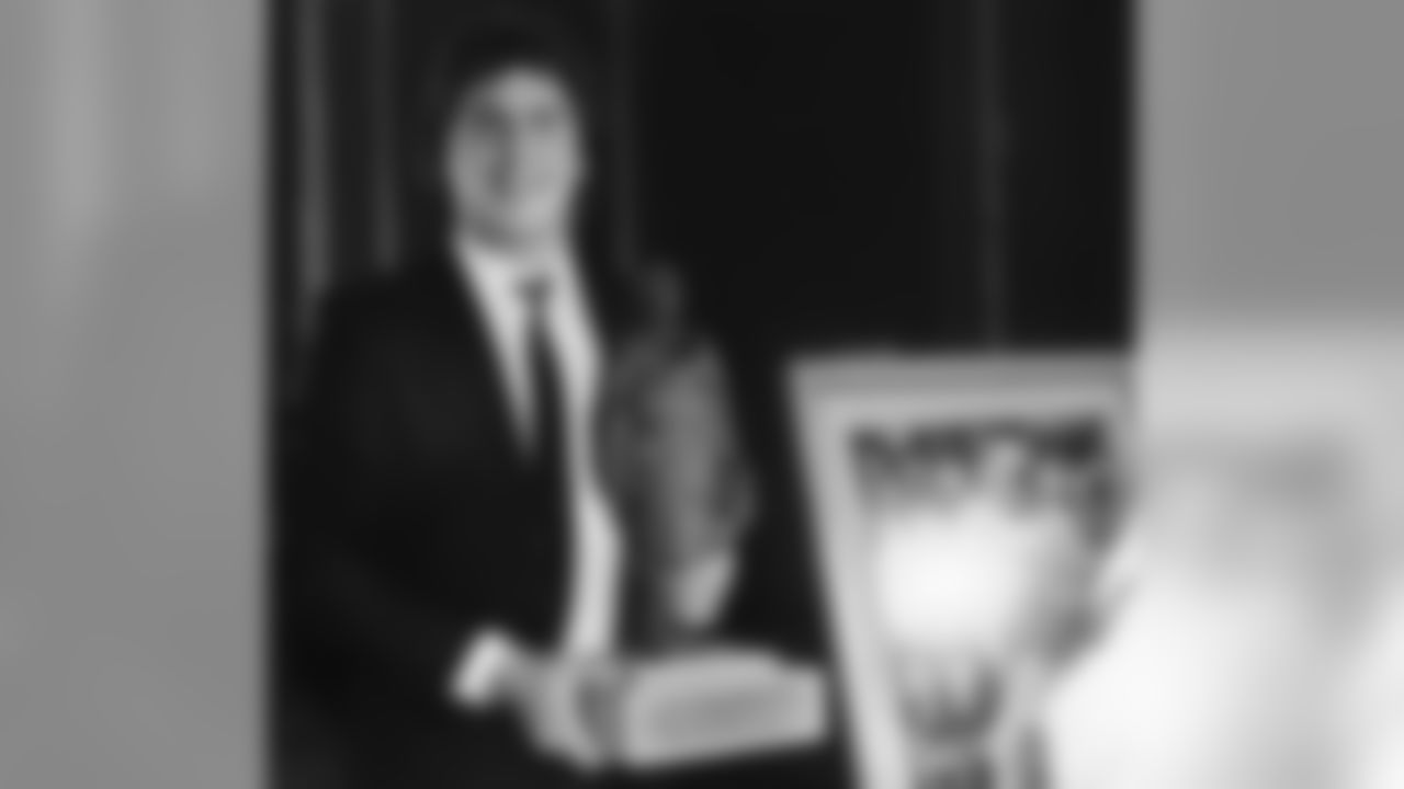 Miami Dolphins quarterback Dan Marino holds the Bert Bell Award which is presented by the Robert W. Maxwell Memorial Football Club to the NFL?s outstanding player of the year, Tuesday, Feb. 19, 1985, Philadelphia, Pa. (AP Photo/Amy Sancetta)