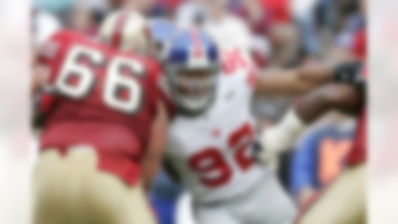 New York Giants defensive end Michael Strahan (92) rushes the quarterback during an NFL game against the San Francisco 49ers, Nov. 6, 2005 in San Francisco. (AP Photo/Greg Trott)