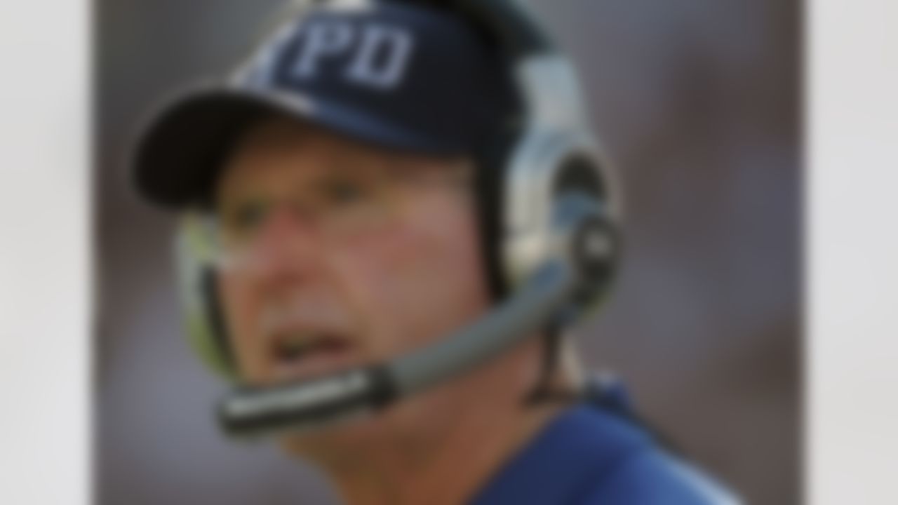 New York Giants head coach Tom Coughlin wearing an New York Police Department cap watches the action on the field during the first half of an NFL football game against the Washington Redskins in Landover, Md., on Sunday, Sept. 11, 2011. (AP Photo/Cliff Owen)