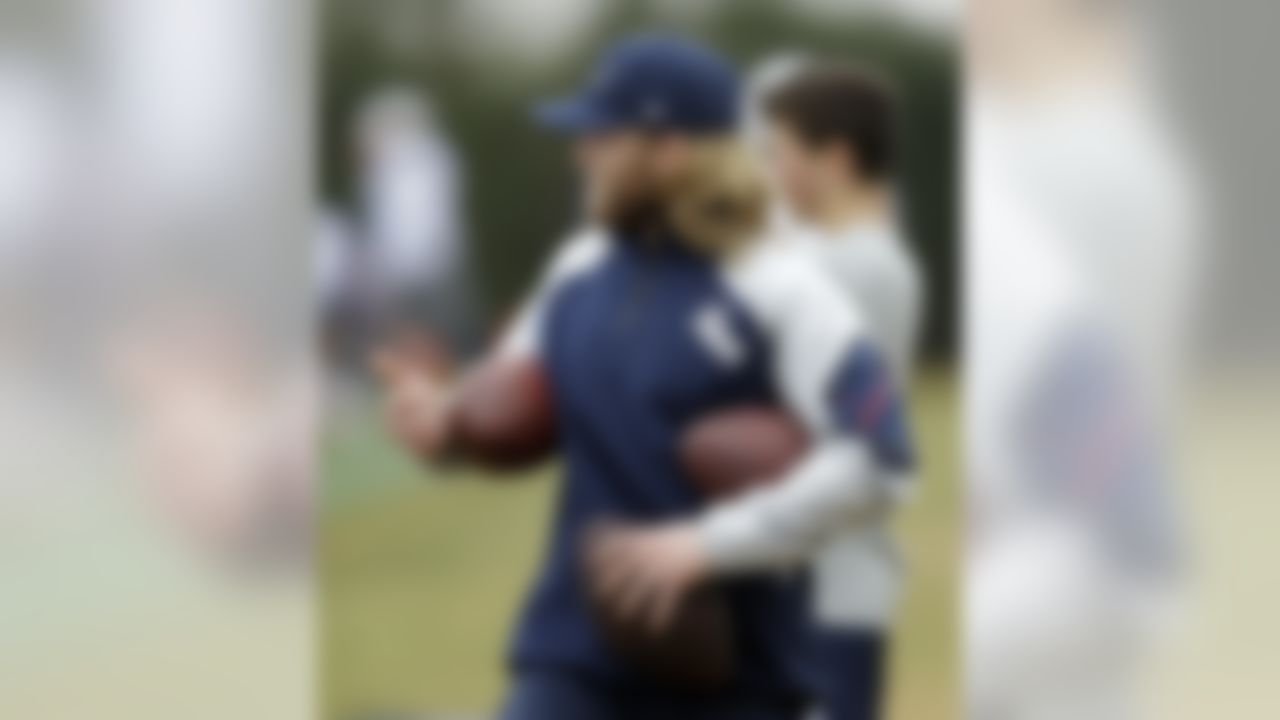 New England Patriots coaching assistant Steve Belichick holds footballs during practice Friday, Jan. 30, 2015, in Tempe, Ariz. The Patriots play the Seattle Seahawks in NFL football Super Bowl XLIX Sunday, Feb. 1. Belichick is the son of head coach Bill Belichick. (AP Photo/Mark Humphrey)