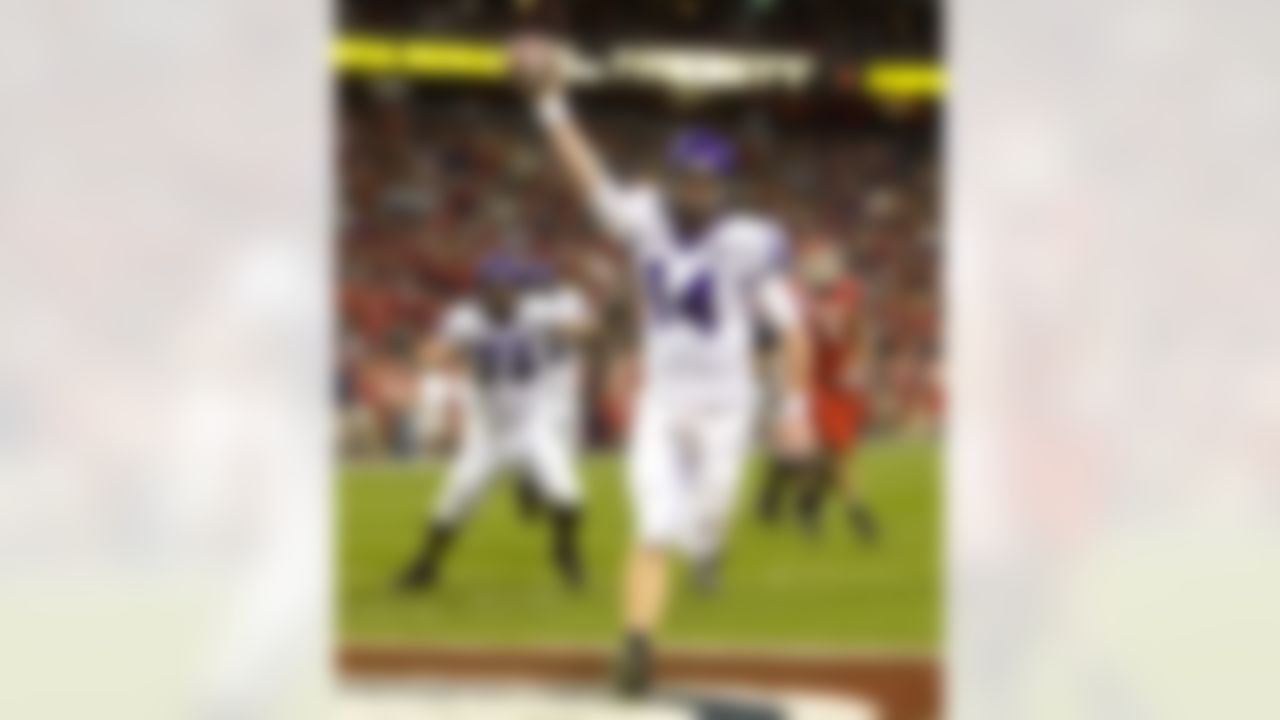 TCU quarterback Andy Dalton scores on a three yard bootleg during the second quarter of the Texas Bowl football game Friday Dec. 28, 2007 in Houston. (AP Photo/Bob Levey)