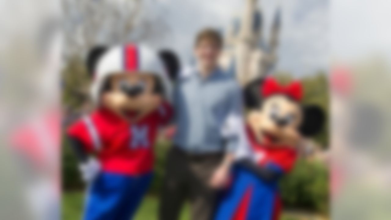 Super Bowl XLVI MVP and New York Giants quarterback Eli Manning poses with Mickey and Minnie Mouse Monday Feb. 6, 2012 at the Magic Kingdom at Walt Disney World Resort in Lake Buena Vista, Fla. Manning visited the theme park one day after he led his team to a 21-17 victory over the New England Patriots in Super Bowl XLVI in Indianapolis. Immediately following the game, Manning looked into TV cameras and shouted "I'm Going to Disney World!" He is the latest star in the famous Disney commercial series. (AP Photo/Disney, Gene Duncan)