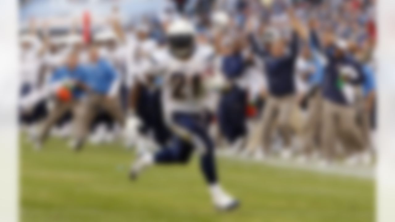 San Diego Chargers running back LaDainian Tomlinson (21) scores a touchdown on a 16-yard run in the overtime period of an NFL football game to give the Chargers a 23-17 win over the Tennessee Titans in Nashville, Tenn., Sunday, Dec. 9, 2007. Tomlinson ran for 146 yards in the game. (AP Photo/John Russell)