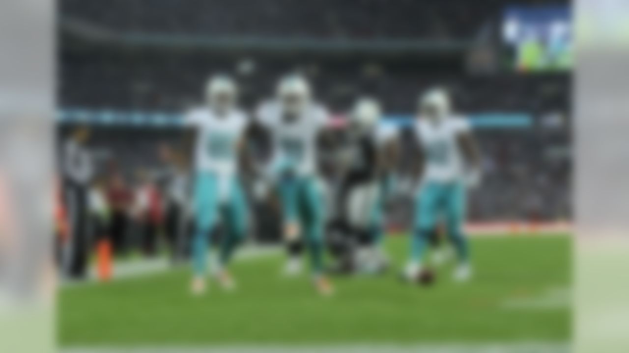 Mike Wallace of Miami celebrates his touchdown against the Oakland Raiders at Wembley Stadium in London.(Sean Ryan/NFL)