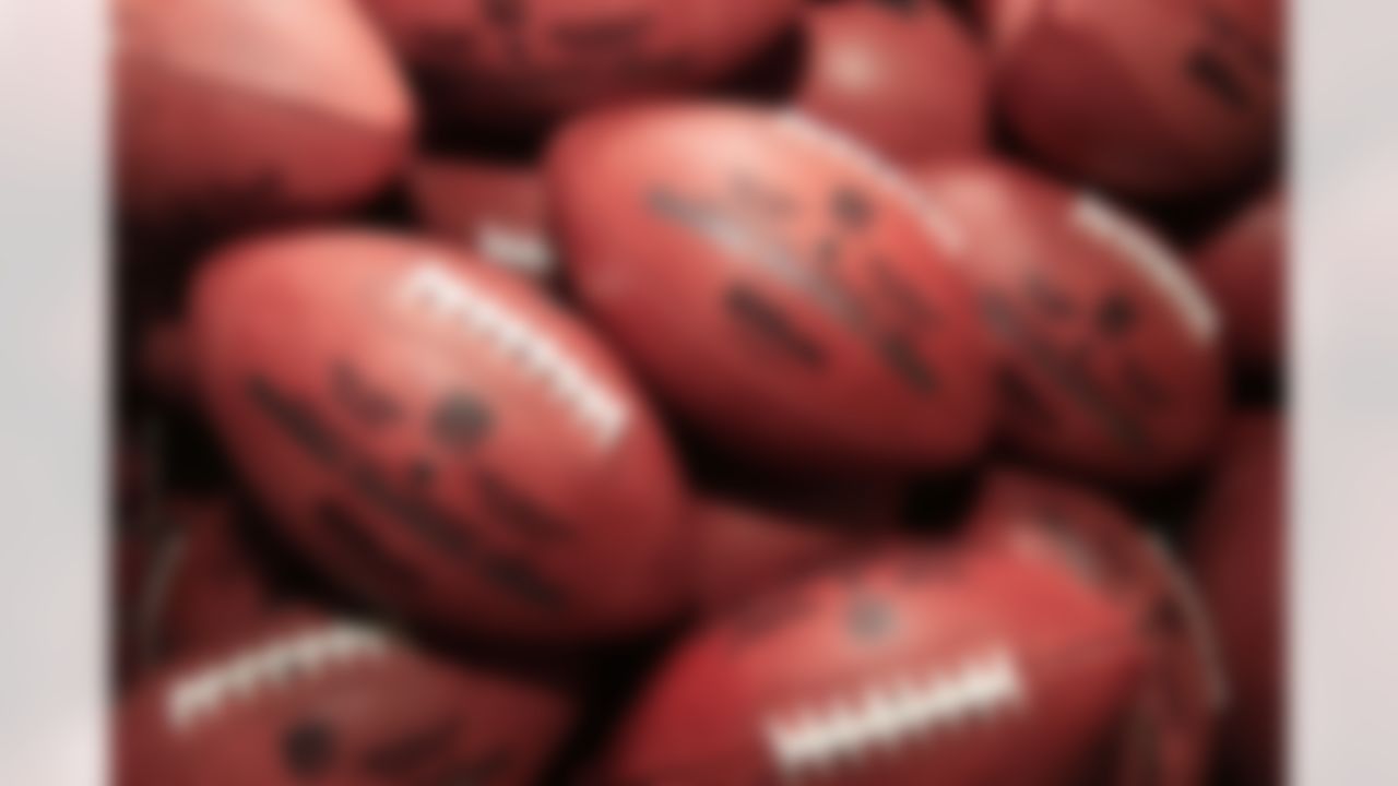NFL football Super Bowl XLVI official game balls rest in a bin after inspection at Wilson Sporting Goods Co. in Ada, Ohio, Monday, Jan. 23, 2012. The New England Patriots will play the New York Giants in the Super Bowl on Feb. 5 in Indianapolis. (AP Photo/Tony Dejak)