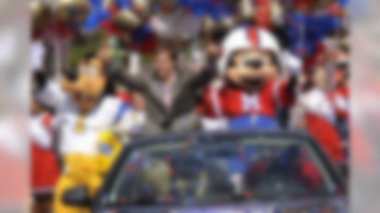 In this Monday, Feb. 8, 2010 photo released by Disney, Super Bowl XLIV MVP, New Orleans Saints quarterback Drew Brees joins Disney characters Mickey Mouse and Goofy in a parade in the Magic Kingdom in Lake Buena Vista, Fla., celebrating the Saints' 31-17 victory over the Indianapolis Colts in Sunday's Super Bowl. (AP Photo/Disney, Kent Phillips)