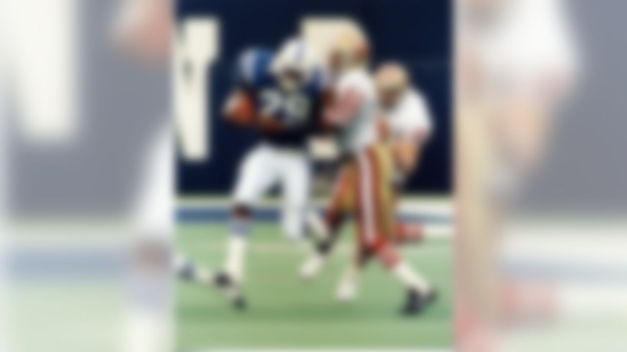 Running back Eric Dickerson (29) of the Indianapolis Colts and safety Ronnie Lott (42) of the San Francisco 49ers in a 30-24 49er victory on September 10, 1989, at the Hoosier Dome in Indianapolis, Indiana. (Don Larson/NFL)