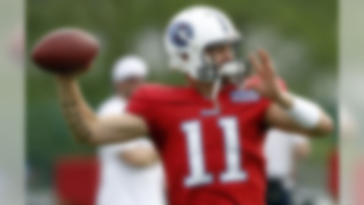 Tennessee Titans quarterback Rusty Smith (11) throws during NFL football camp at Titans' headquarters Monday, July 30, 2012 Nashville, Tenn. (AP Photo/Wade Payne)