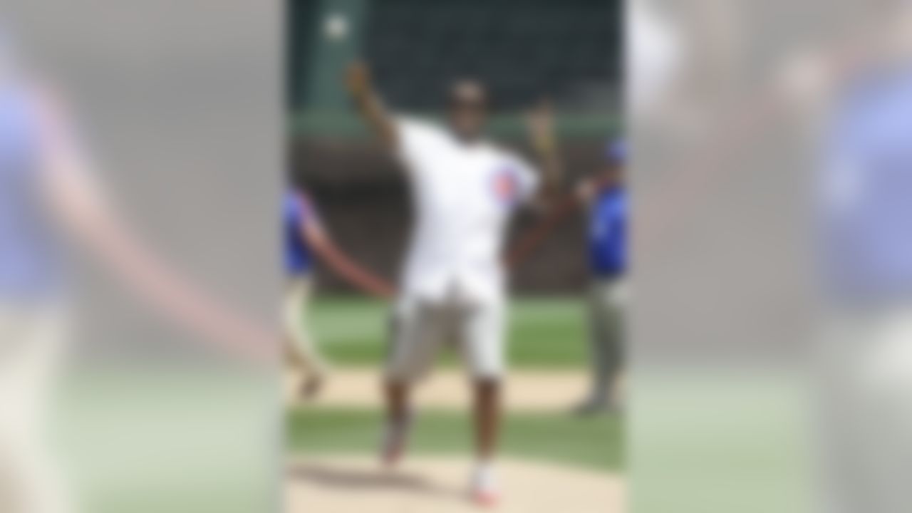 Chicago Bears NFL football player Tim Jennings throws out the ceremonial first pitch before a baseball game between the Chicago Cubs and the San Diego Padres in Chicago, Friday, April 17, 2015. (AP Photo/Nam Y. Huh)