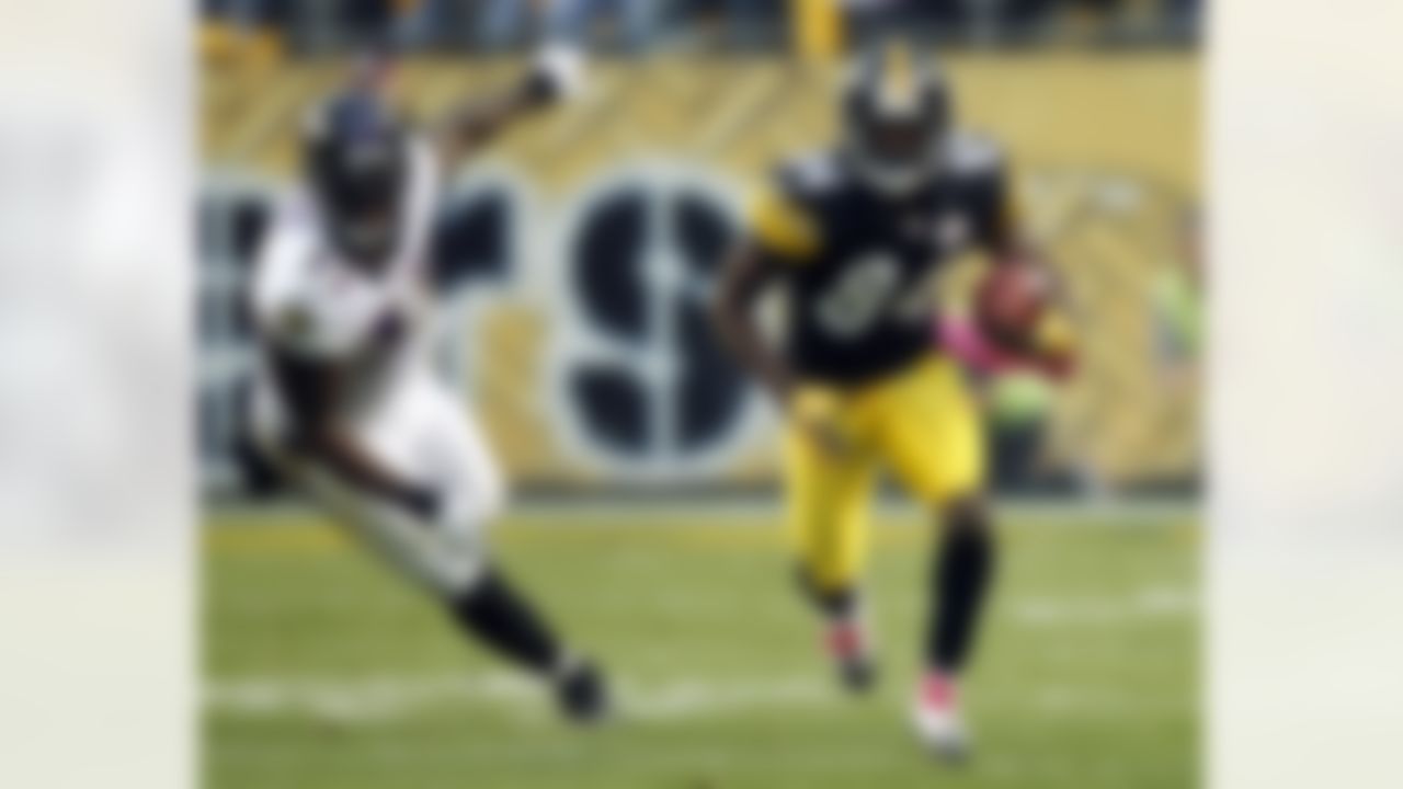 Pittsburgh Steelers wide receiver Antonio Brown (84) runs past Baltimore Ravens linebacker Terrell Suggs (55) after a catch in the NFL football game between the Pittsburgh Steelers and the Baltimore Ravens in Pittsburgh, Sunday, Oct. 3, 2010. (AP Photo/Keith Srakocic)