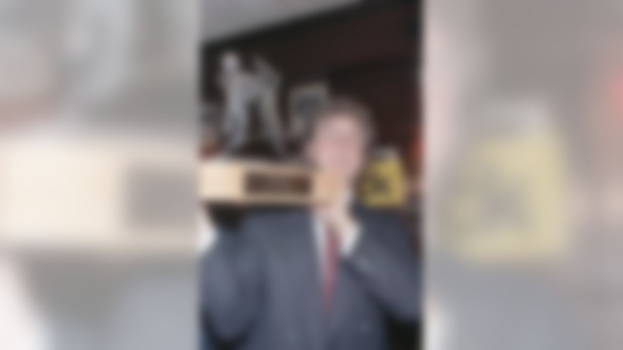 Dan Marino of the Miami Dolphins, who was voted the NFL?s MVP for 1984, holds trophy in New York, Jan. 7, 1985. (AP Photo/Dave Pickoff)