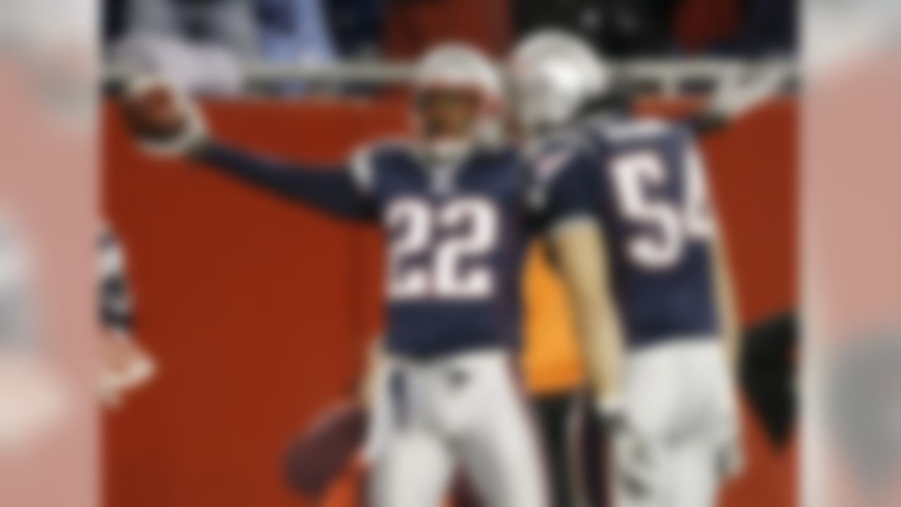 New England Patriots' Asante Samuel celebrates his fourth quarter interception in front of teammate Tedy Bruschi (54) against the Philadelphia Eagles during New England's 31-28 win in a football game at Gillette Stadium in Foxborough, Mass. Sunday, Nov. 25, 2007. (AP Photo/Winslow Townson)