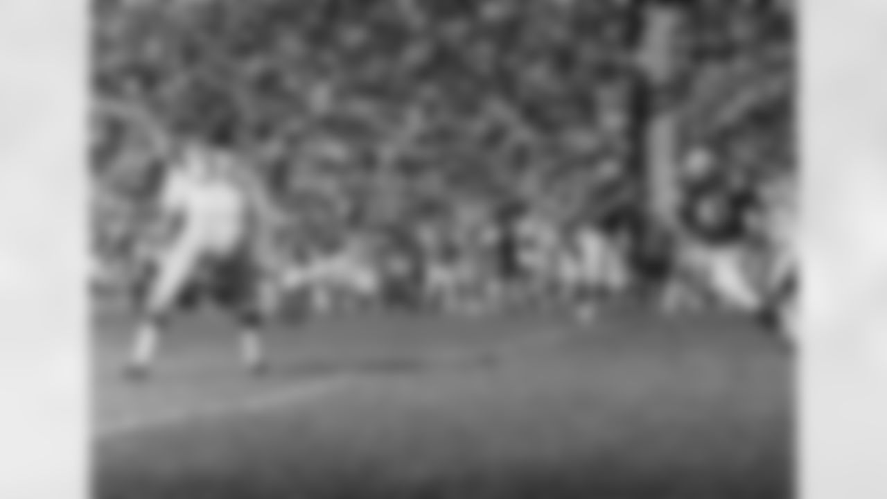 End John Mackey of the Baltimore Clots takes a first half Johnny Unitas pass good for a first down to the Ram?s 40-yard line as Maxie Baughan (55) moves in to try to break it up. Tom Matte (41) of the Colts is at right on Dec. 17, 1967 in Los Angeles. (Associated Press)