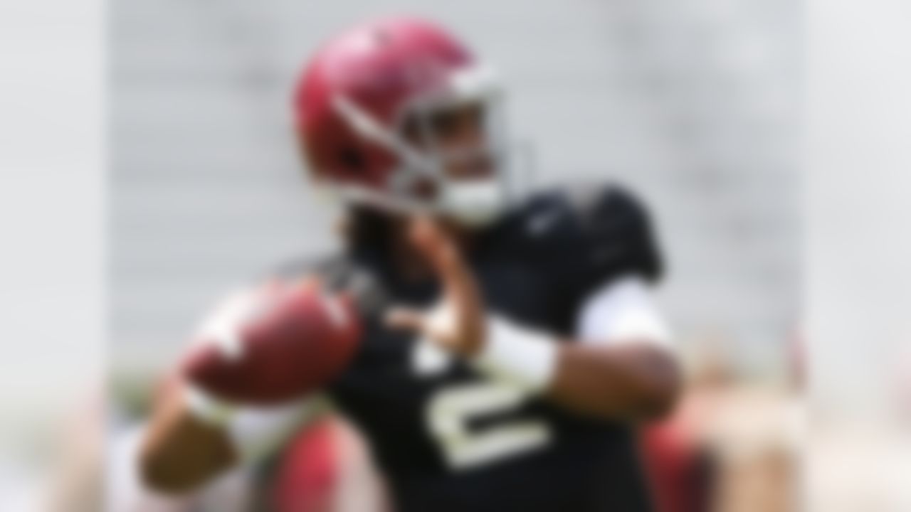 Alabama quarterback Jalen Hurts sets back to pass during an NCAA college football practice, in Tuscaloosa, Al. on Aug. 7, 2016. (AP Photo/Brynn Anderson, File)