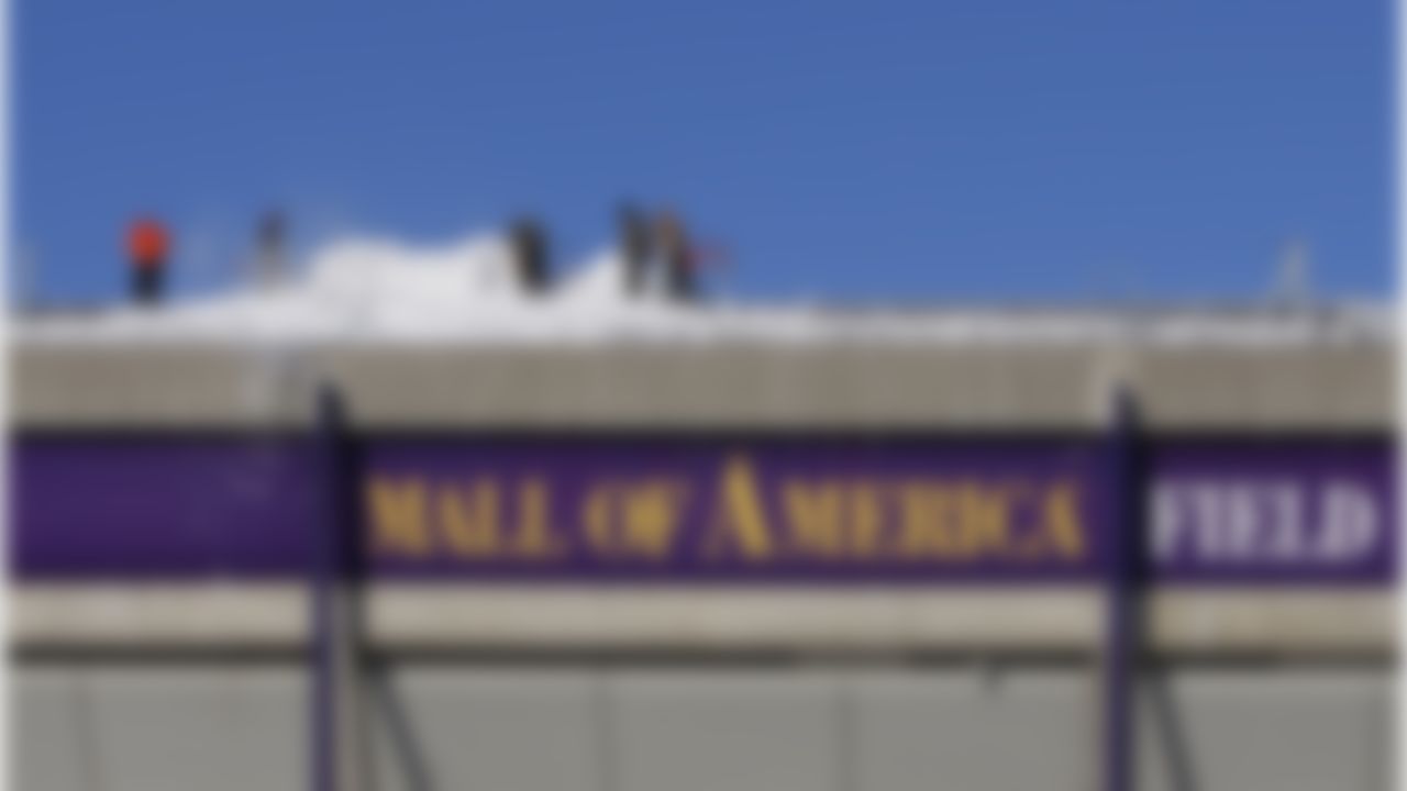 Workers shovel snow off the roof of Mall of America Field at the Hubert H. Humphrey Metrodome in Minneapolis Sunday, Dec. 12, 2010. The inflatable roof of the Metrodome collapsed Sunday after a snowstorm that dumped 17 inches on Minneapolis. No one was hurt, but the roof failure sent the NFL scrambling to find a new venue for the Vikings' game against the New York Giants.(AP Photo/Ann Heisenfelt)